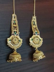 Gold Jhumka Earrings with Green Stones