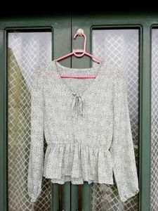 Chic Printed Peplum Blouse with Tie Neck
