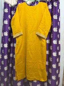 Elegant Yellow Kurti pant with Intricate Neckline