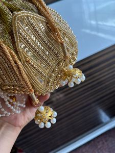 Elegant Gold Embellished Potli Bag