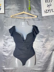 Chic Black Off-Shoulder Bodysuit