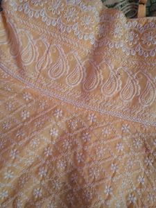 orange coloured sleeveless top