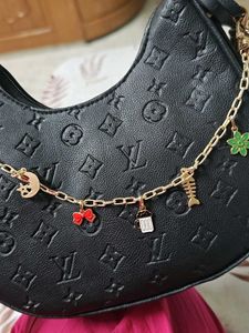 Chic Black Embossed Hobo Bag with Charms