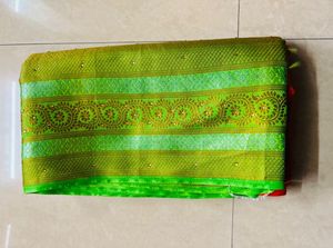 Vibrant Orange Silk Saree with Green Border