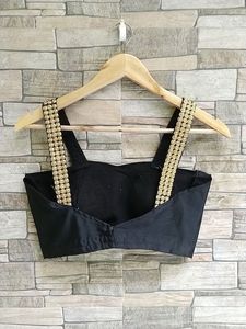 Stylish Black Blouse with Embellished Straps