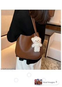 Chic Cream Shoulder Bag with Cute Charm