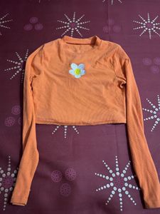 Orange Cropped Long Sleeve Top with Flower