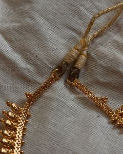 Elegant Gold Tone Necklace with Tassel