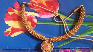 Elegant Gold-Tone Necklace with Pink Stone Pendant