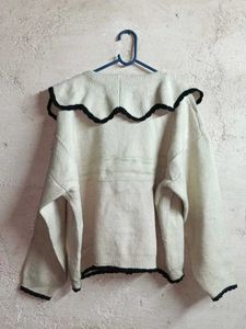 Chic Cream Knit Cardigan with Black Trim