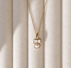 Elegant Pearl and Bow Necklace