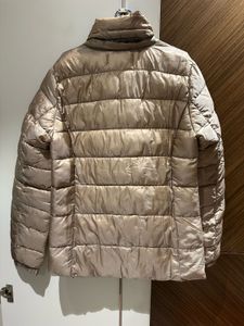 Light gold puffer jacket from Mango