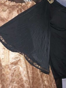 black kurti with golden lehga