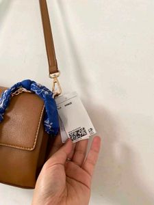 Chic Brown Shoulder Bag with Scarf Accent