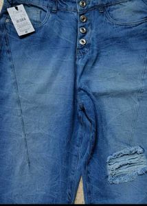Distressed Blue Denim Jeans