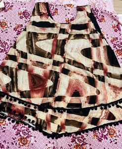 Printed Sleeveless Peplum Top with Pom-Pom Lace