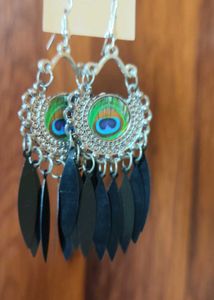 Peacock feather oxidised earrings and shell cowrie