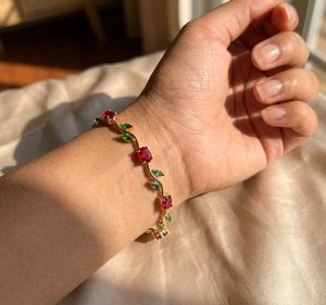 Elegant Gold Bracelet with Red &amp; Green Stones
