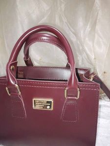 Elegant Maroon Handbag with Shoulder Strap