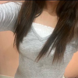 Grey ribbed V-neck top with lace detail