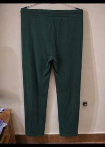 a green track pant