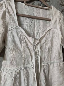 Chic White Lace-Up Peplum Top
