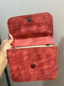 Stylish Red Crossbody Bag with Gold Embellishments