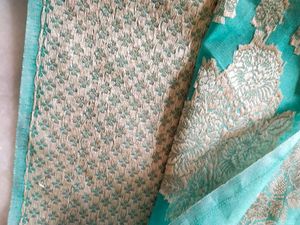 Beautiful Teal dress material with woven silk work