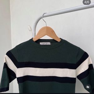 Green and White printed top.