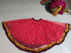 Beautiful Pink Net lehnga with Gold Embellishments