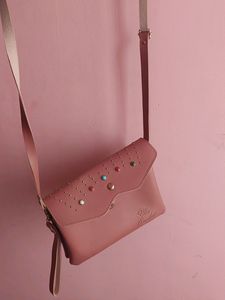Peach Colour Sling Bag With 2 zips Can Carry Mobile ,wallet Cards And Make Up Items.