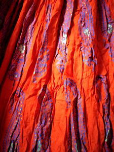 Ethnic skirt, deep Orange colour with blue print.