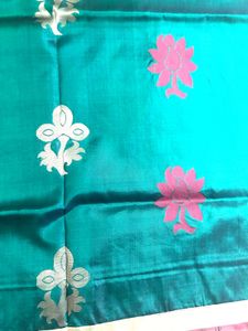 Elegant Teal Saree with Floral Motifs