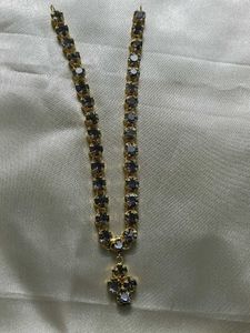 Elegant Gold Chain with Dark Stones