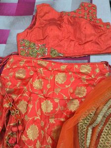 Stunning Orange Lehenga Choli with Gold Floral