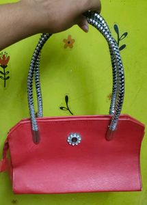 Chic Red Handbag with Silver Handles