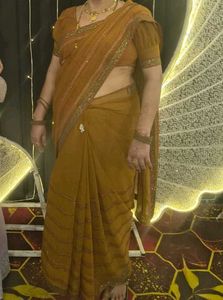 Elegant mustard heavy party wear saree with blouse