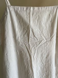 white sleeveless kurta with pink stripped pants