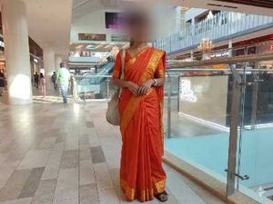 Vibrant Orange Saree with Golden Border