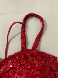 red backless blouse
