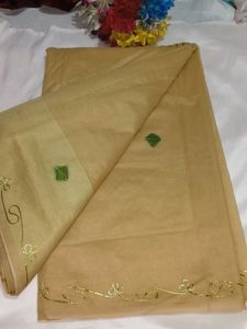 Elegant Beige Saree with Green Floral Embroidery