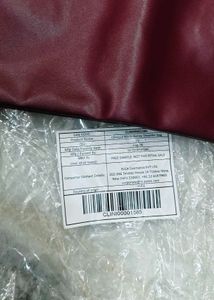 Clinique burgundy Leather Bag.