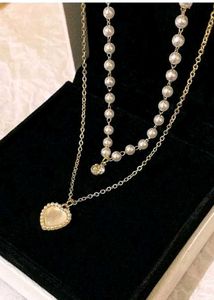 Layered Pearl Necklace with Heart Pendant