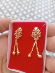 Elegant Gold Tone Earrings with Red Stones