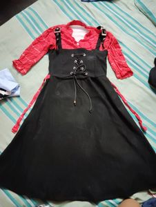 Cute Black Frock With Bright Red Neck Part.