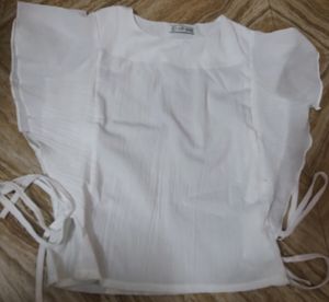 White Top With Shoulder Frill And Knot Style.