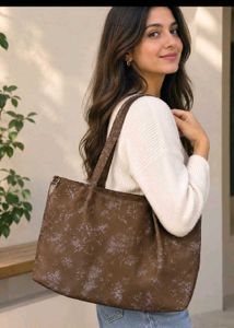 Cute shoulder bag with self color floral print.