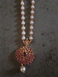 Elegant Pearl Necklace with Red Stones