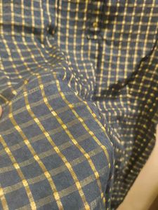 A max black kurta with golden stripes