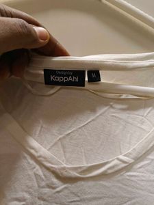 white tee with beeded pocket style